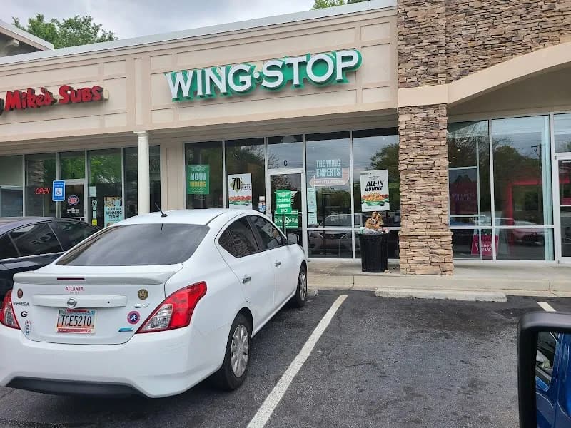 Wingstop storefront outside and inside view at 2050 Scenic Hwy in Snellville, Georgia