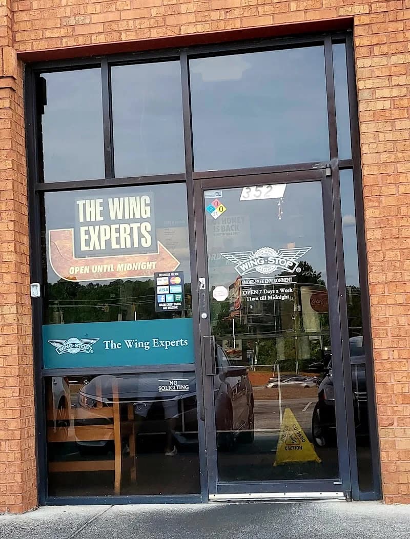 Wingstop storefront outside and inside view at 3527 hwy 138 in Stockbridge, Georgia