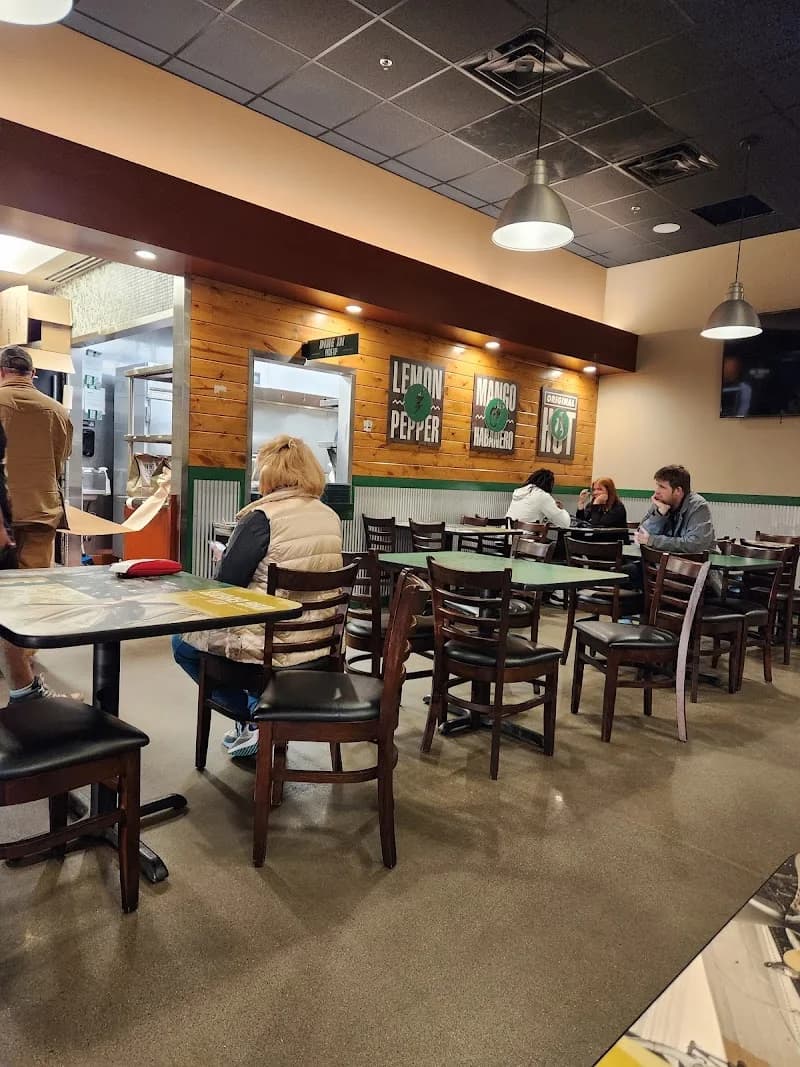 Wingstop storefront outside and inside view at 3803 Merle Hay Rd. in Des Moines, Iowa