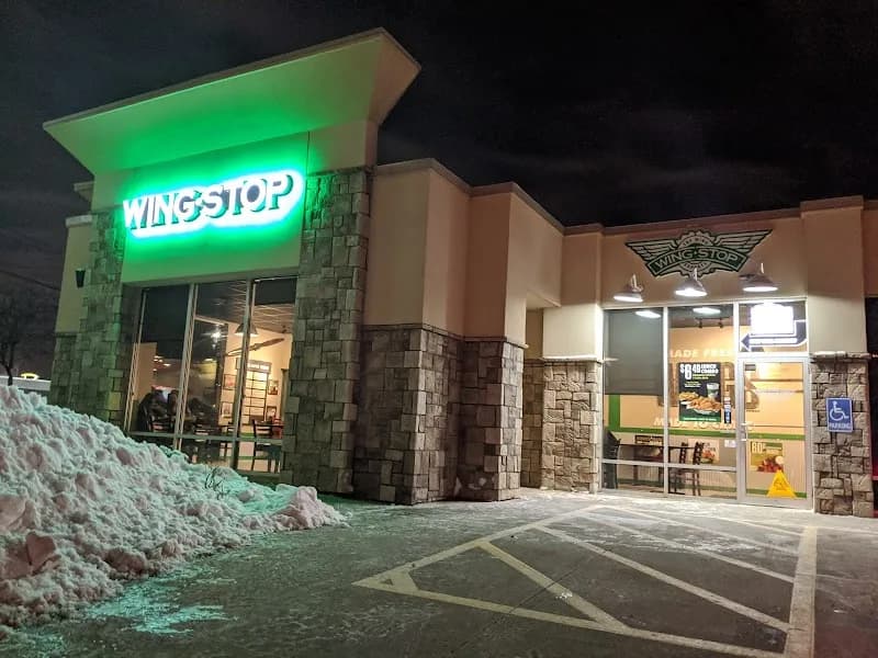Wingstop storefront outside and inside view at 521 E. 14TH ST. in Des Moines, Iowa