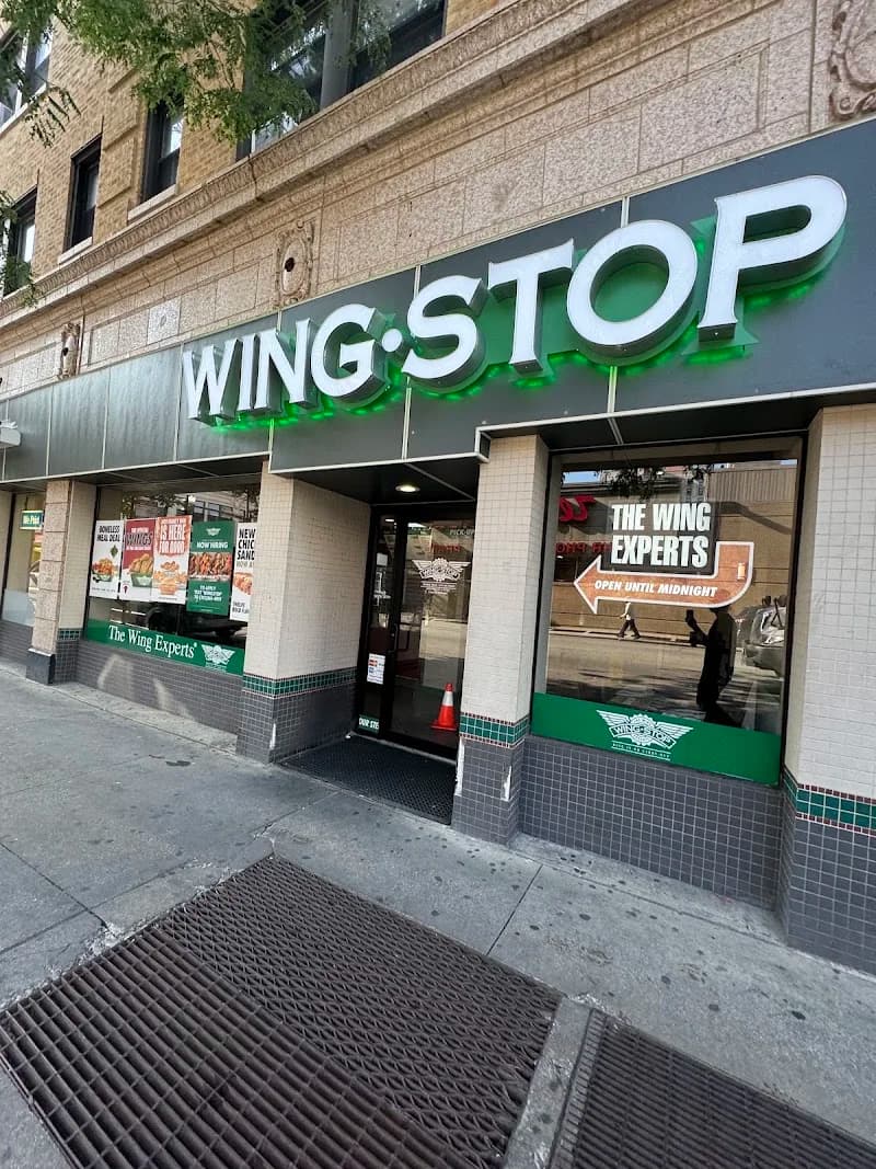 Wingstop storefront outside and inside view at 47 W Division St in Chicago, Illinois