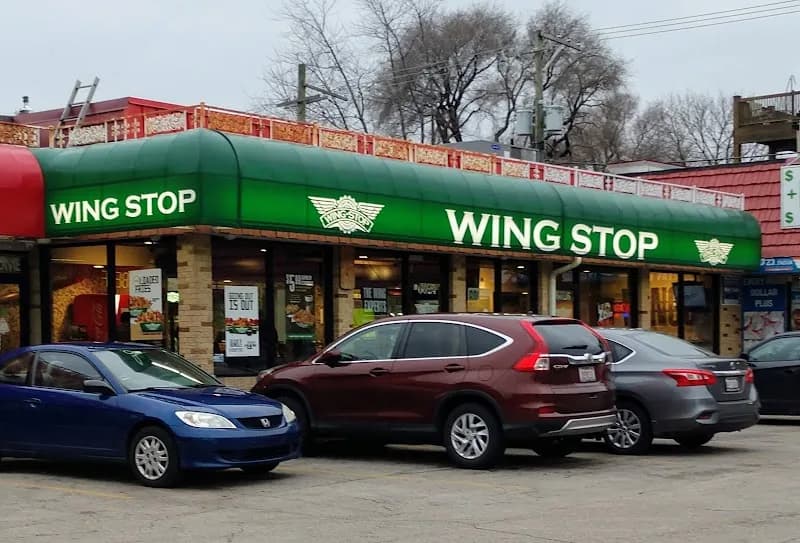 Wingstop storefront outside and inside view at 6024 N Broadway St in Chicago, Illinois