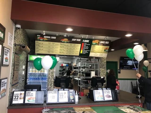 Wingstop storefront outside and inside view at 7003 N. Clark Street in Chicago, Illinois
