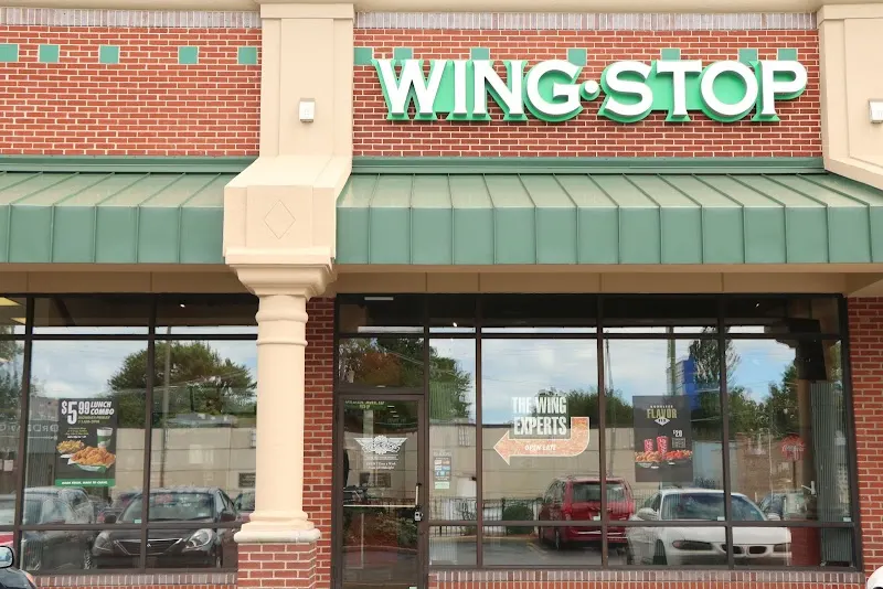 Wingstop storefront outside and inside view at 1521 E. 87th St. in Chicago, Illinois