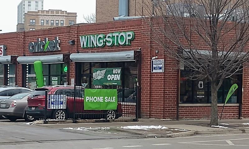 Wingstop storefront outside and inside view at 4547 N. Broadway St in Chicago, Illinois