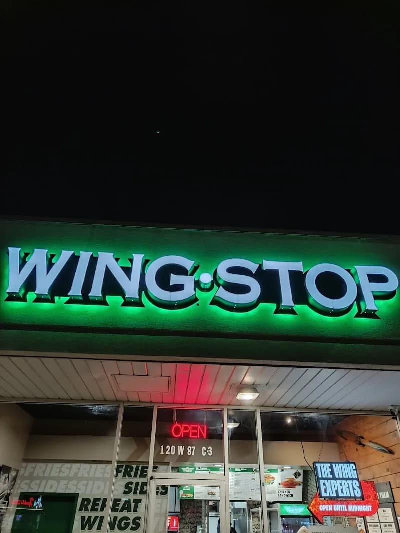 Wingstop storefront outside and inside view at 120 W. 87th Street in Chicago, Illinois