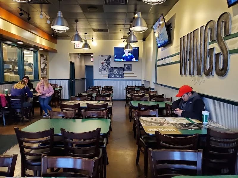 Wingstop storefront outside and inside view at 1372 Winston Plaza in Melrose Park, Illinois