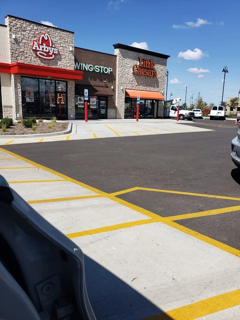 Wingstop storefront outside and inside view at 472 S Weber Road in Romeoville, Illinois